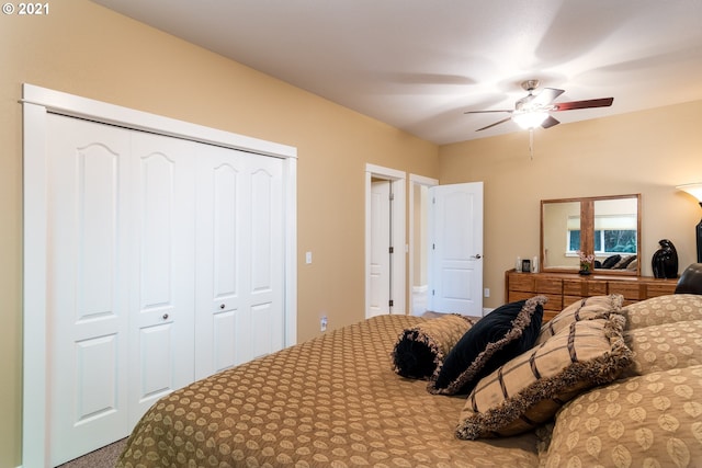 bedroom with carpet flooring, a closet, and ceiling fan