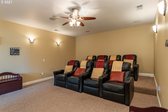 cinema featuring light carpet and ceiling fan