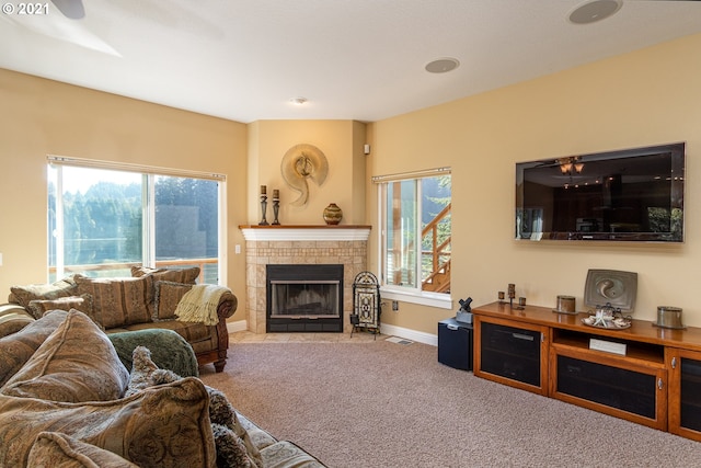 carpeted living room featuring a fireplace