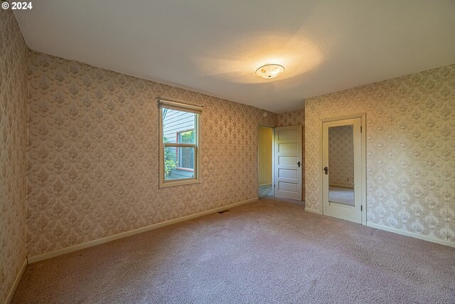 unfurnished bedroom with carpet floors