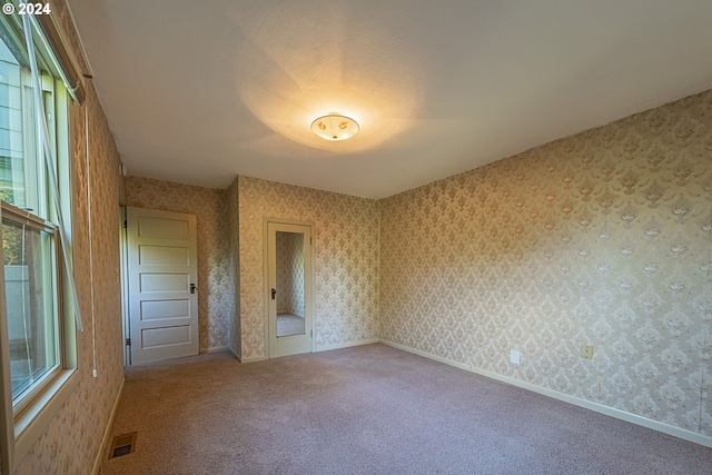 unfurnished bedroom featuring carpet flooring