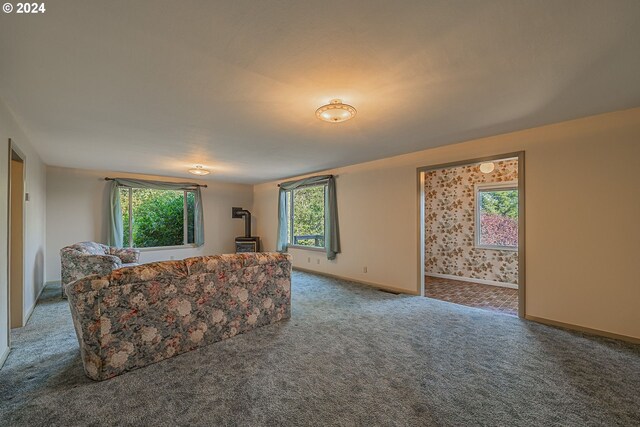 carpeted living room featuring plenty of natural light