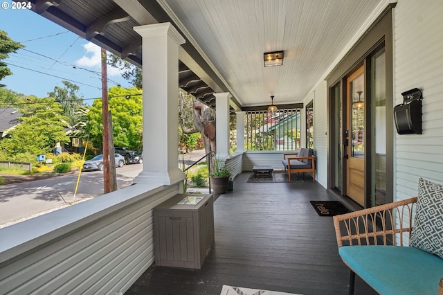 wooden deck featuring covered porch