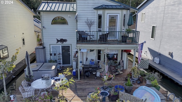 rear view of property featuring a deck