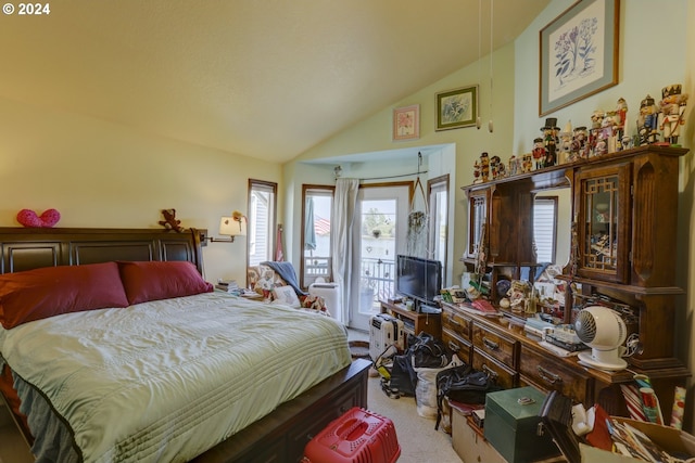 bedroom with lofted ceiling, light carpet, and access to outside