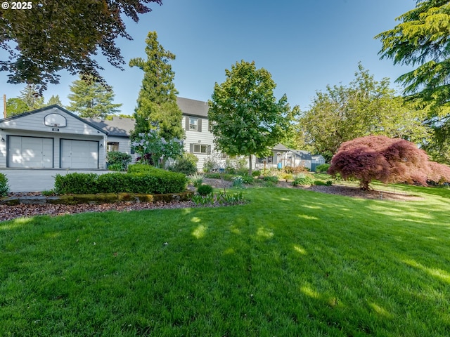 view of yard with a garage