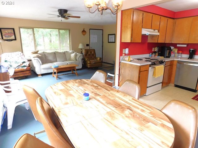 kitchen featuring ceiling fan with notable chandelier, gas range gas stove, and stainless steel dishwasher