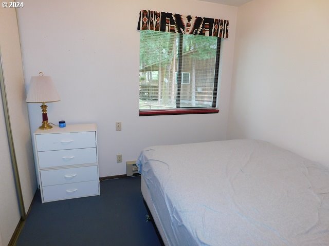 unfurnished bedroom with a baseboard radiator