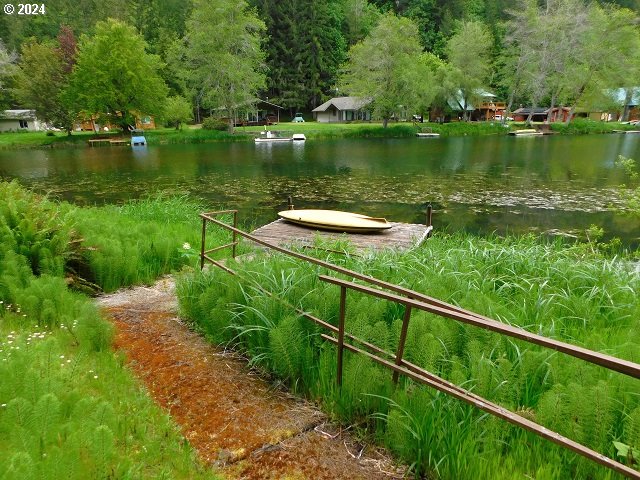 view of home's community with a water view