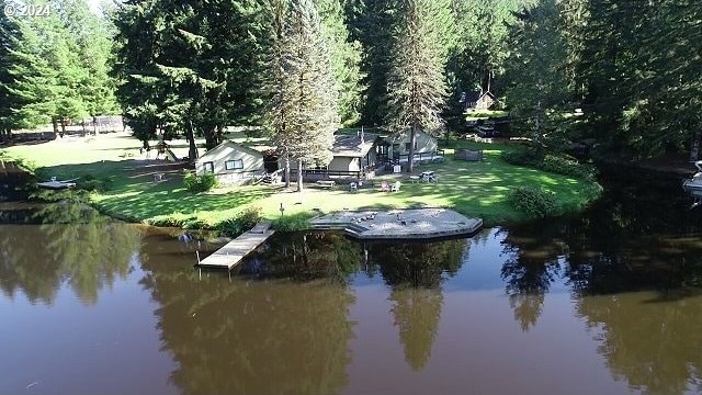 exterior space with a yard and a water view