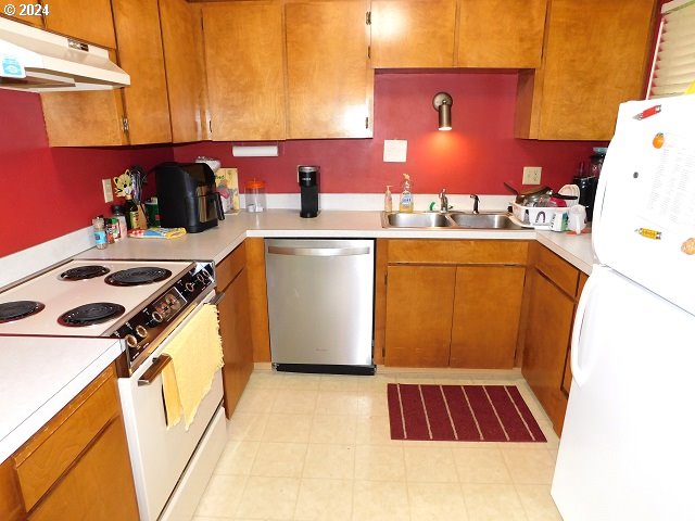 kitchen with white appliances and sink