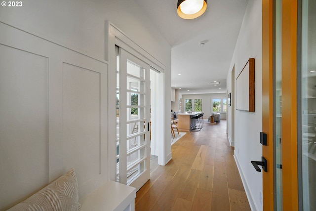 entryway with light hardwood / wood-style flooring