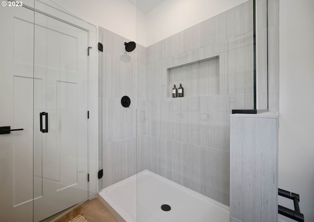 bathroom with a tile shower