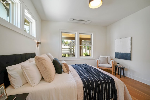 bedroom featuring hardwood / wood-style floors