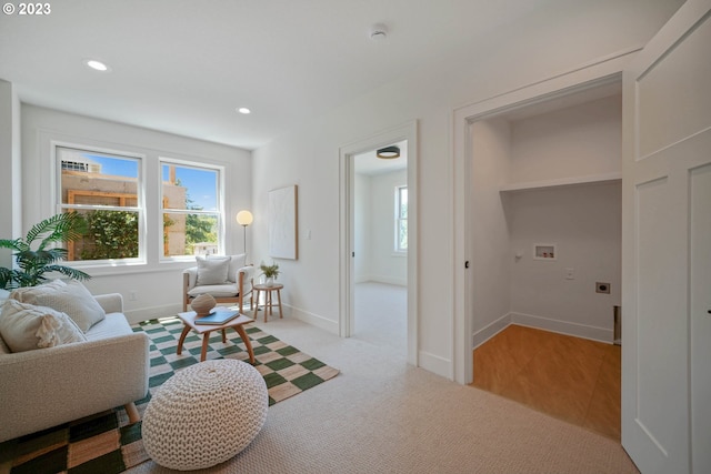 living room featuring light carpet