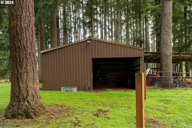 view of outbuilding with a lawn