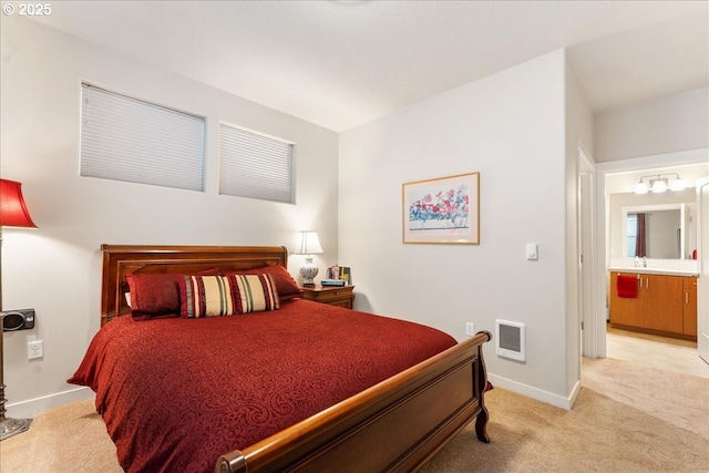 carpeted bedroom with ensuite bath