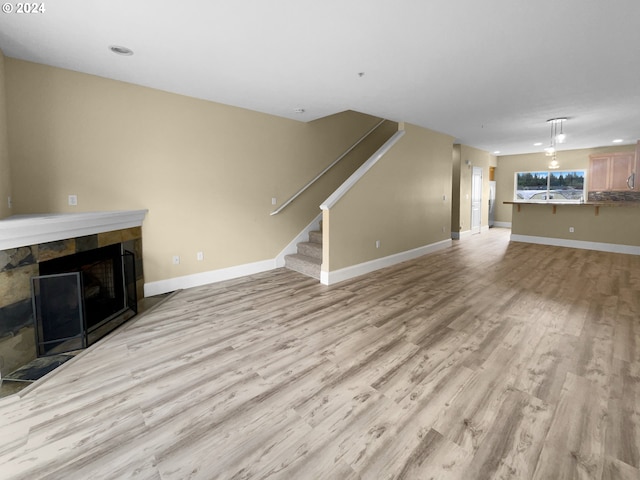 unfurnished living room with light wood-type flooring