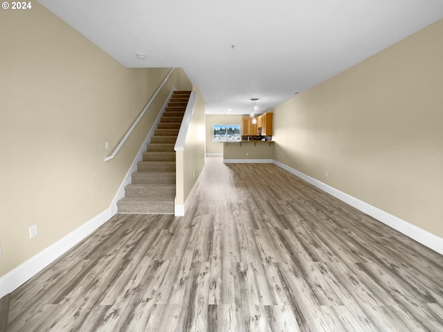 unfurnished living room with light wood-type flooring