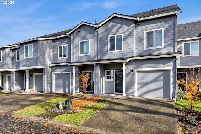 multi unit property featuring a garage