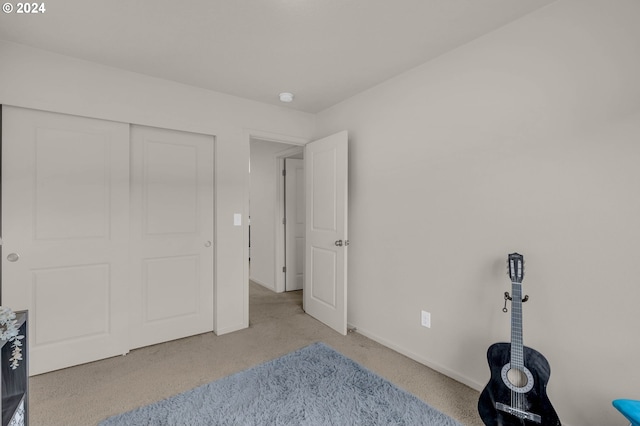 bedroom featuring carpet flooring and baseboards