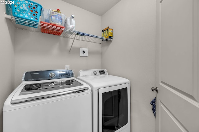 laundry area featuring washing machine and clothes dryer