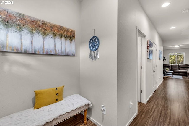 corridor featuring recessed lighting, baseboards, and wood finished floors