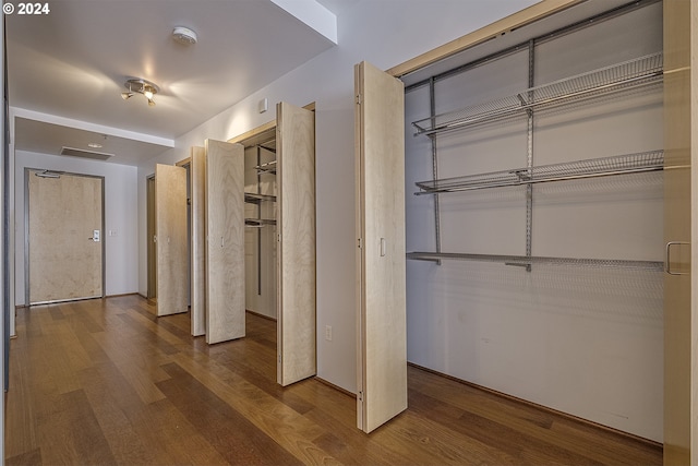 hallway featuring hardwood / wood-style flooring