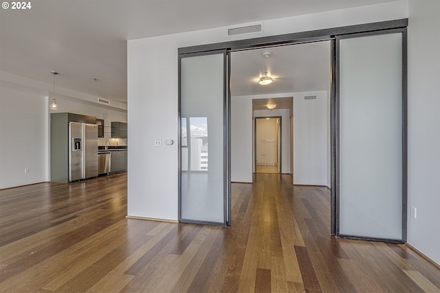 spare room featuring dark hardwood / wood-style floors and sink