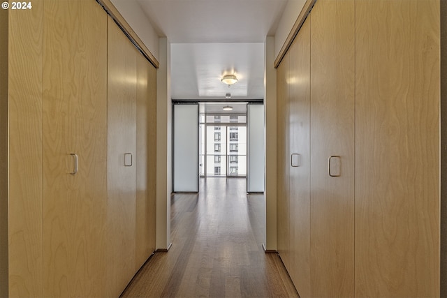 corridor with light wood-type flooring