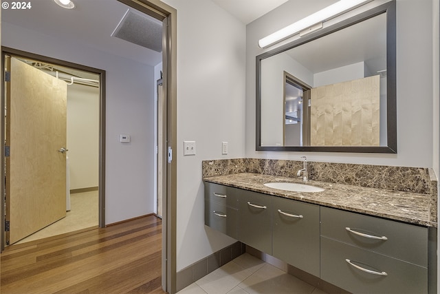 bathroom with vanity and wood-type flooring