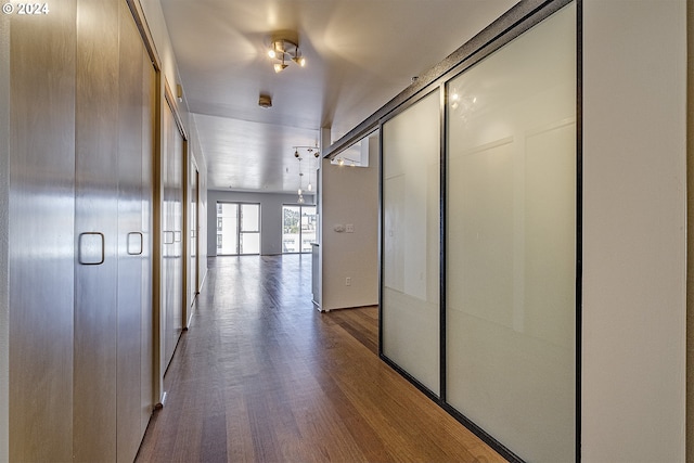 hallway featuring wood-type flooring