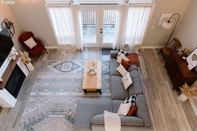 living room with hardwood / wood-style flooring and french doors