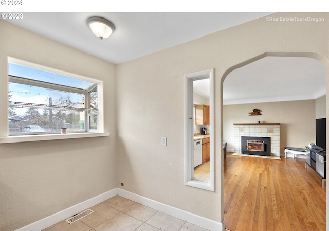 interior space with a fireplace and light wood-type flooring