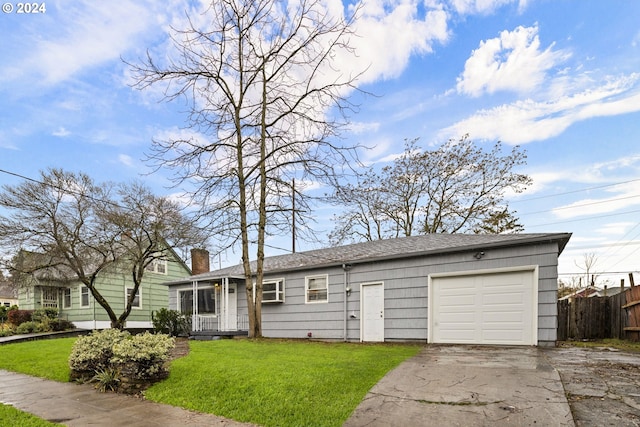 single story home with a front yard and a garage