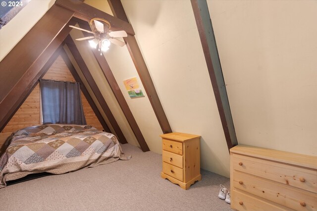 bedroom featuring ceiling fan, lofted ceiling, and carpet