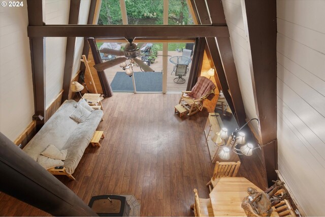 dining area featuring light hardwood / wood-style flooring, sink, a notable chandelier, and wooden walls