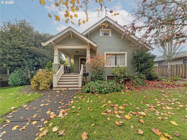 view of front of property with a front lawn and a porch