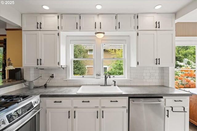 1718 23rd Ave, Forest Grove, OR 97116 - kitchen featuring appliances with stainless steel finishes, a sink, white cabinets, and recessed lighting