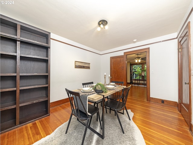 dining area featuring hardwood / wood-style flooring and ceiling fan