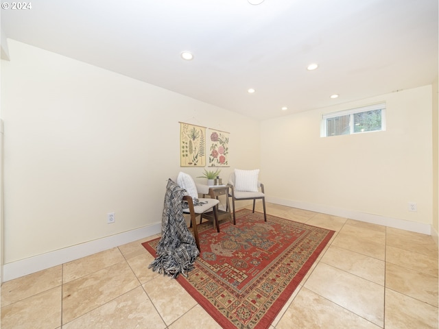 sitting room with light tile patterned floors