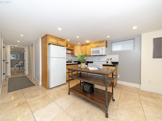 kitchen featuring decorative backsplash, white appliances, light tile patterned floors, light brown cabinets, and electric panel