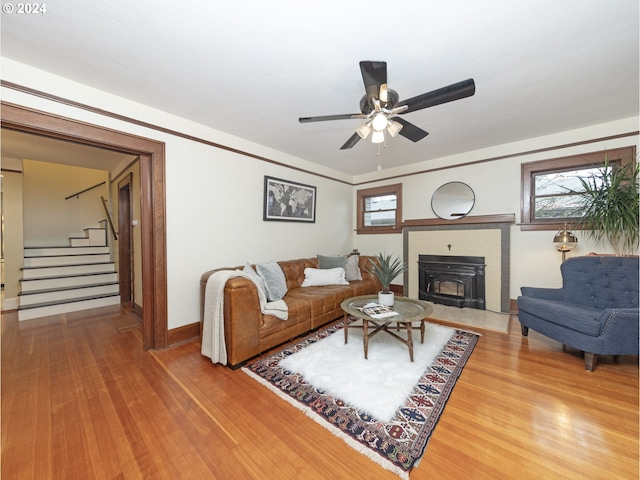 living room with hardwood / wood-style floors and ceiling fan