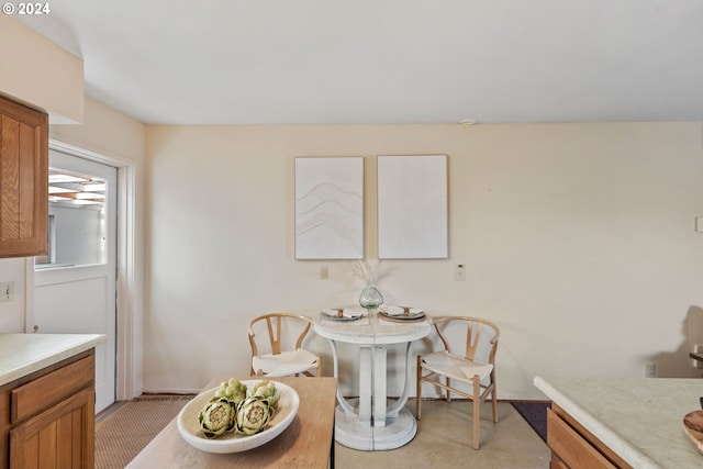 dining room with light carpet