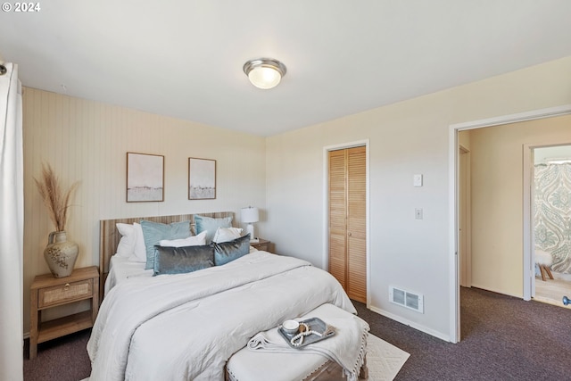 carpeted bedroom with a closet