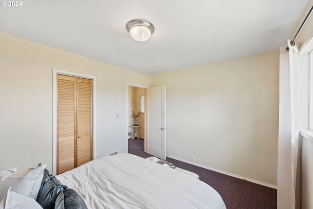 carpeted bedroom with a closet