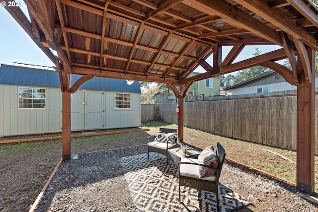 view of patio with a gazebo and a storage shed