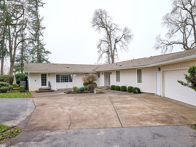 ranch-style home featuring a garage