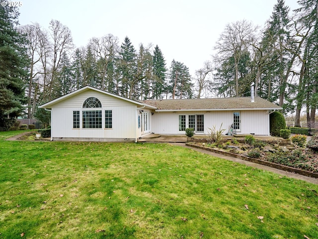 view of front of property featuring french doors and a front yard