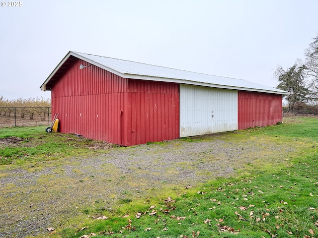 view of outbuilding with a lawn